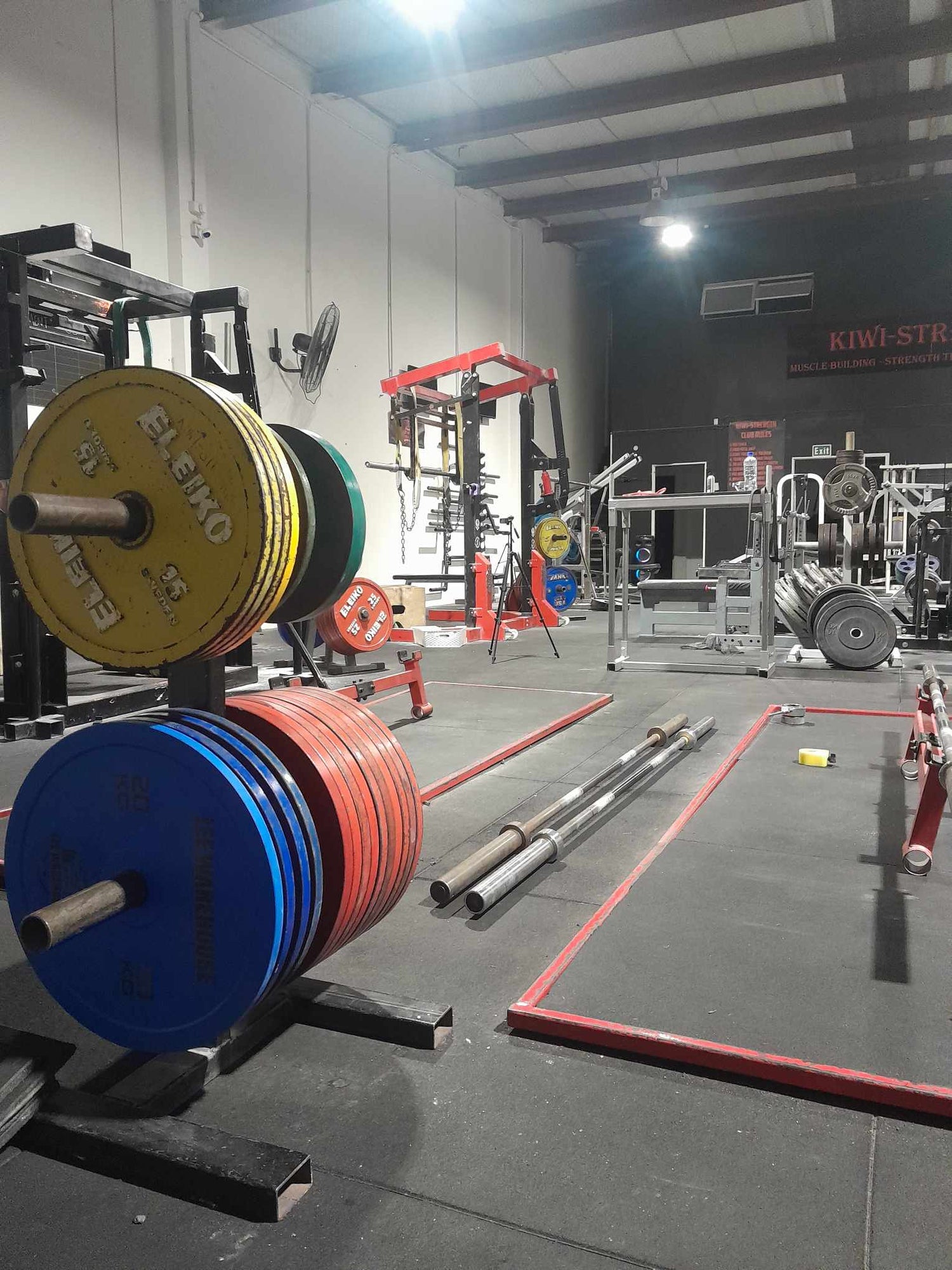 image showing kiwistrength gym and powerlifting plates, deadift bars, mono lifts, eleko rack and plates